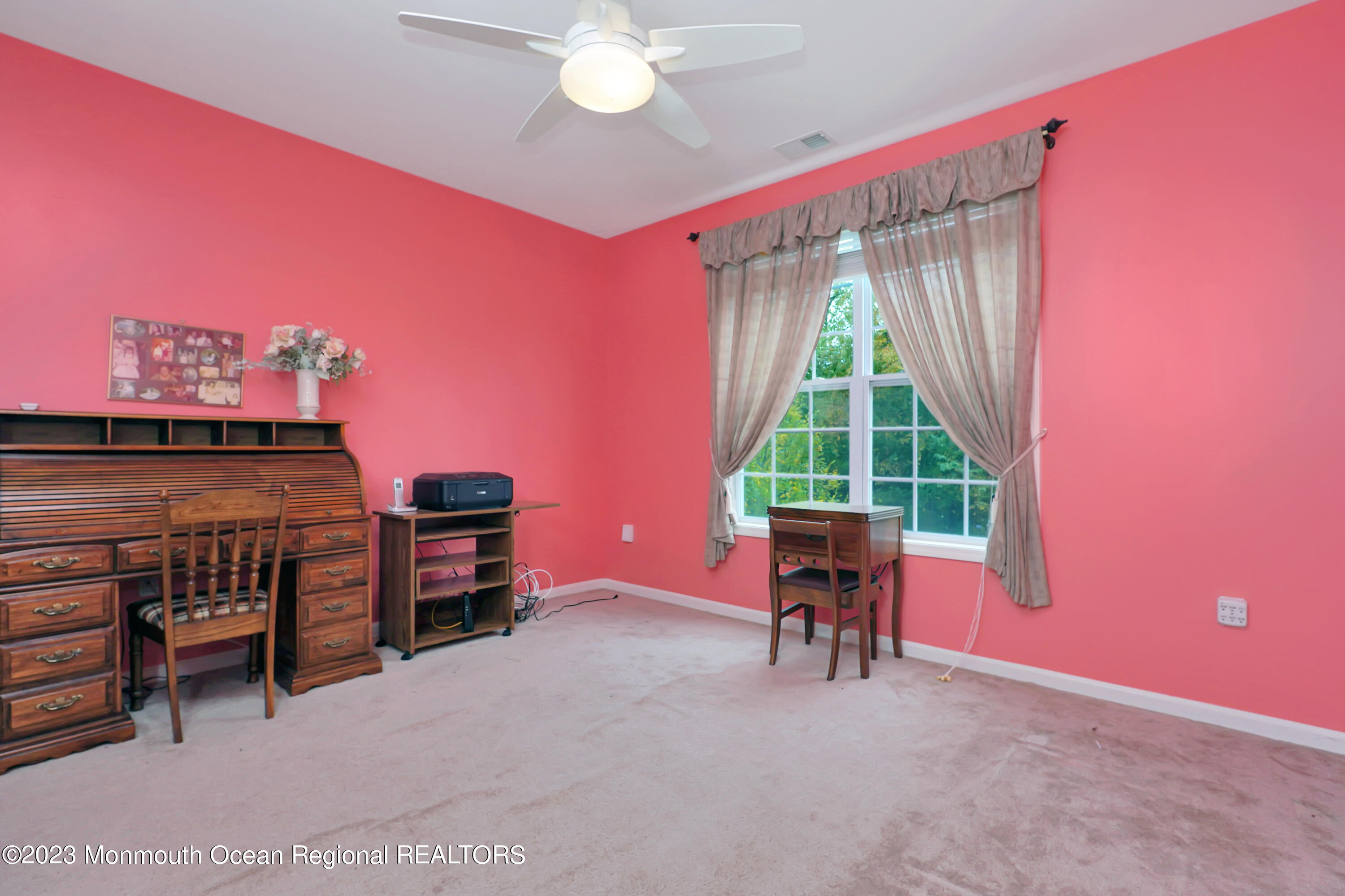211 Potts Road Morganville, NJ 07751 - Photo 17 of 29 a view of a livingroom with furniture and a window