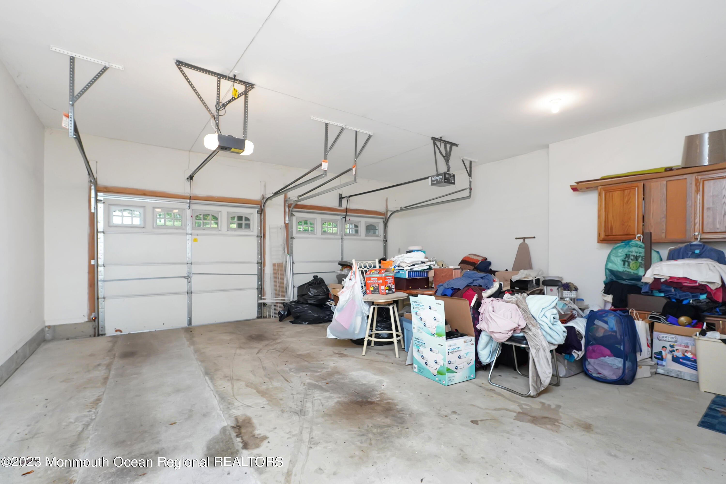 211 Potts Road Morganville, NJ 07751 - Photo 23 of 29 a view of a garage with toys