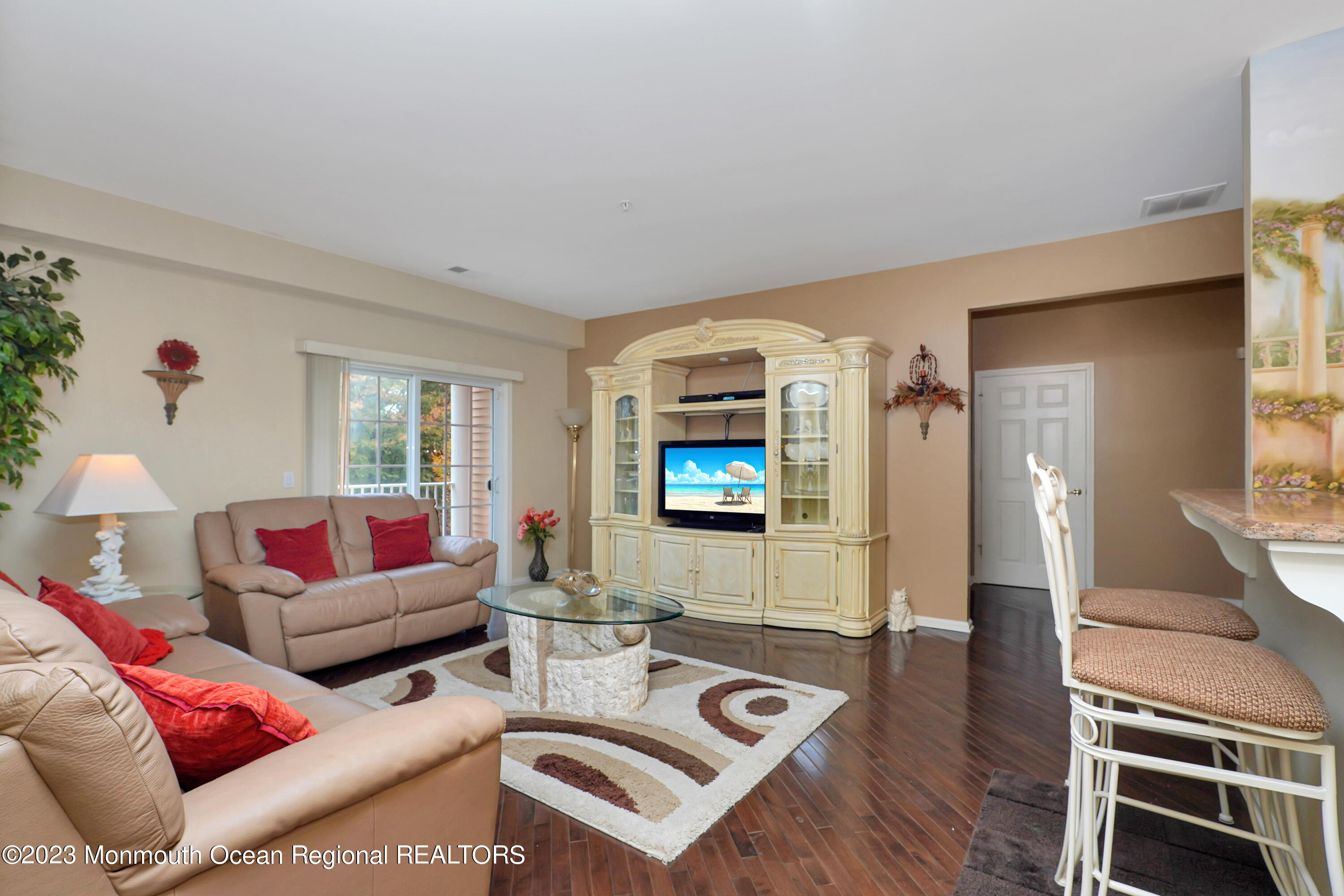 211 Potts Road Morganville, NJ 07751 - Photo 6 of 29 a living room with furniture and a flat screen tv
