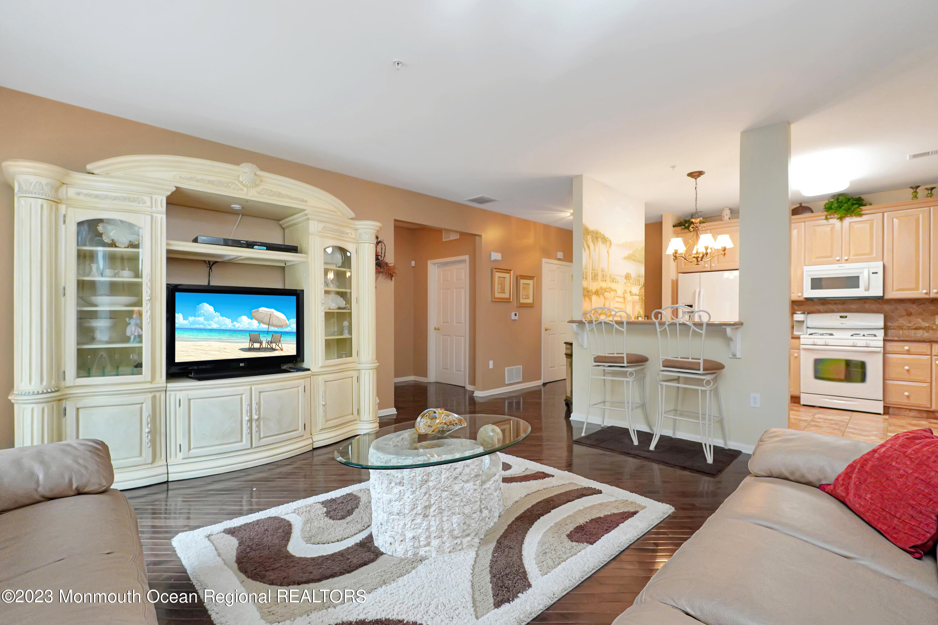 211 Potts Road Morganville, NJ 07751 - Photo 8 of 29 a living room with furniture a large window and a flat screen tv