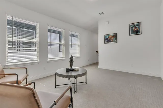 a living room with furniture and window