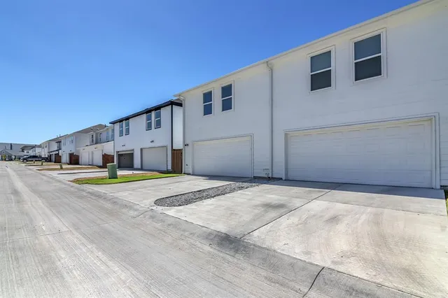 a view of a house with pool and a yard