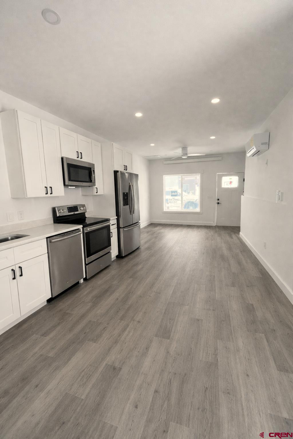 655 5th Street, Unit A Silverton, CO 81433 - Photo 2 of 9 a large kitchen with stainless steel appliances granite countertop a stove a sink and a refrigerator
