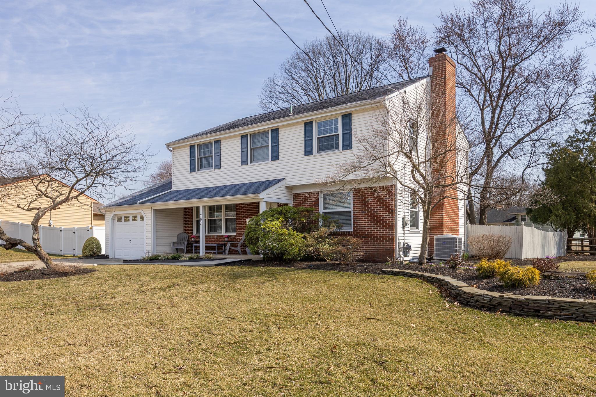 702 Heritage Road Cinnaminson, NJ 08077 - Photo 2 of 30 a view of a house with a yard covered in snow