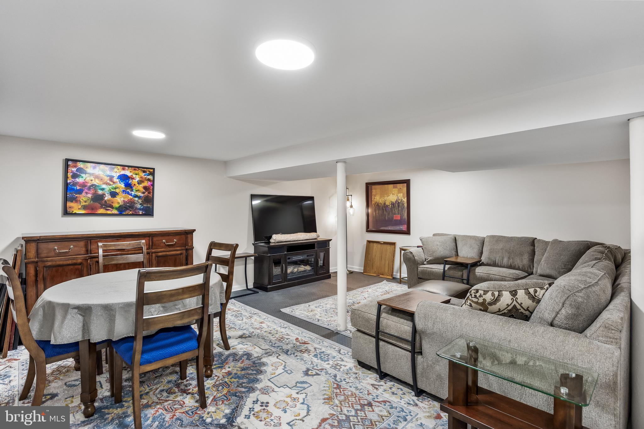 702 Heritage Road Cinnaminson, NJ 08077 - Photo 25 of 30 a living room with furniture a flat screen tv and kitchen view