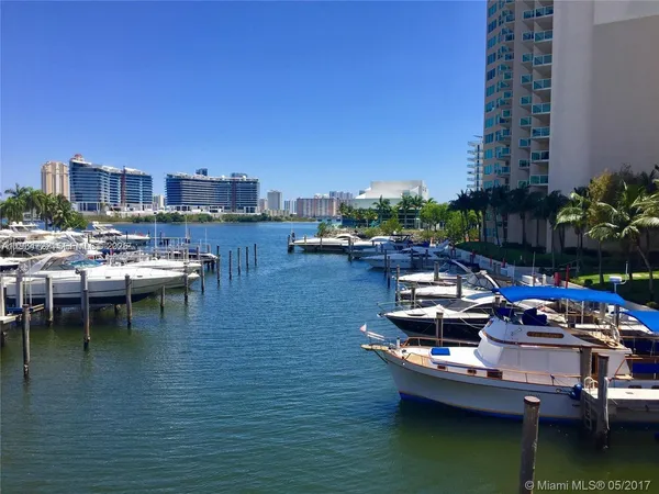 a view of a lake with tall buildings