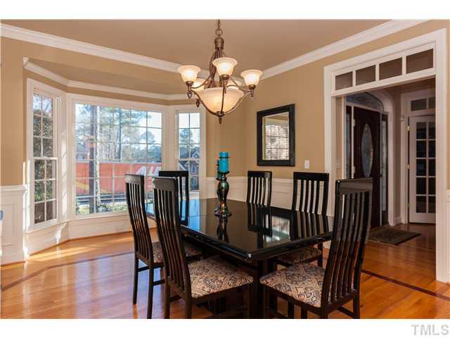 1512 Liatris Lane Raleigh, NC 27613 - Photo 3 of 25 a view of a dining room with furniture wooden floor and chandelier