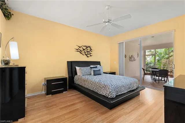 a bedroom with a bed window and a table