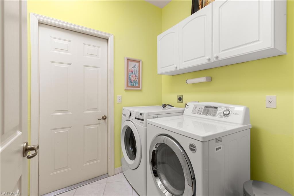 455 Crossfield Circle, Unit 71 Naples, FL 34104 - Photo 23 of 29 a utility room with dryer and washer