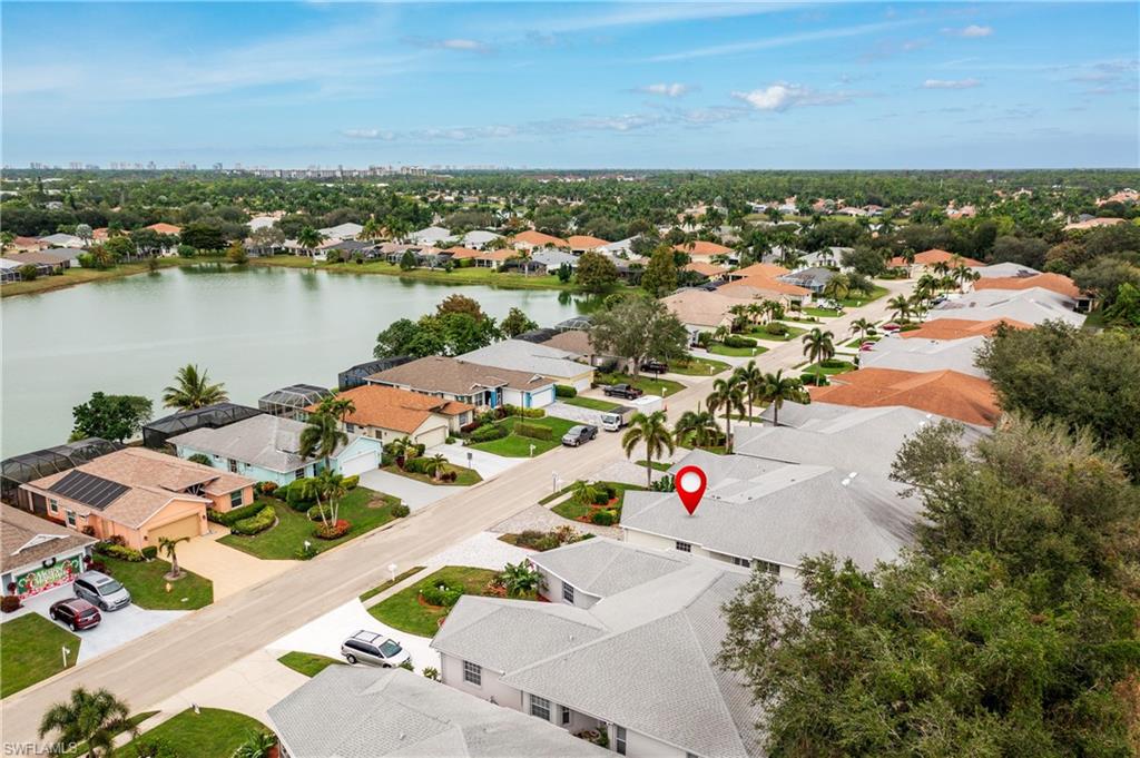 455 Crossfield Circle, Unit 71 Naples, FL 34104 - Photo 27 of 29 an aerial view of residential houses with outdoor space