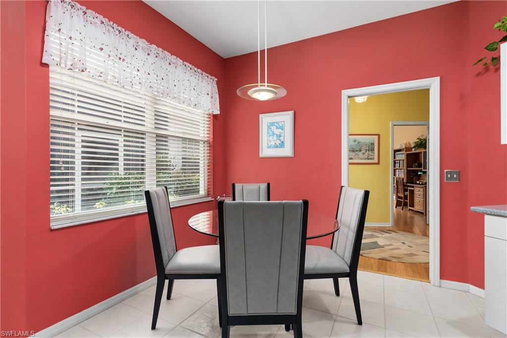 455 Crossfield Circle, Unit 71 Naples, FL 34104 - Photo 10 of 29 a view of a dining room with furniture and window