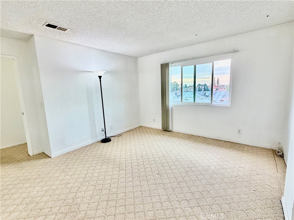 11216 Lower Azusa Road, Unit C El Monte, CA 91731 - Photo 22 of 28 a view of an empty room with a window