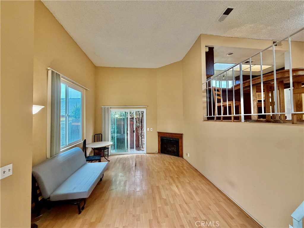 11216 Lower Azusa Road, Unit C El Monte, CA 91731 - Photo 5 of 28 a living room with furniture and a fireplace