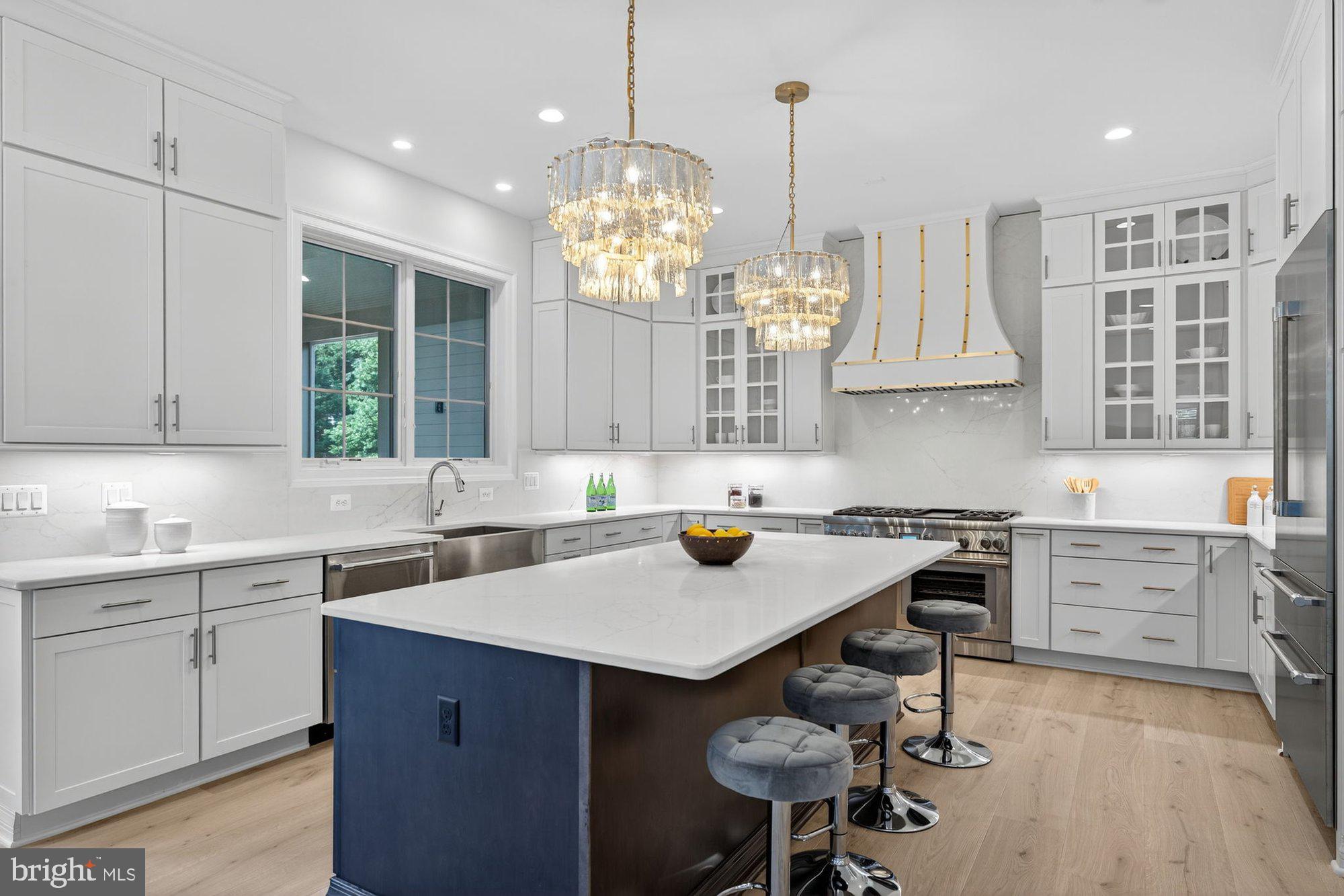 1314 MacBeth Street McLean, VA 22102 - Photo 6 of 13 a kitchen with a sink stove and cabinets