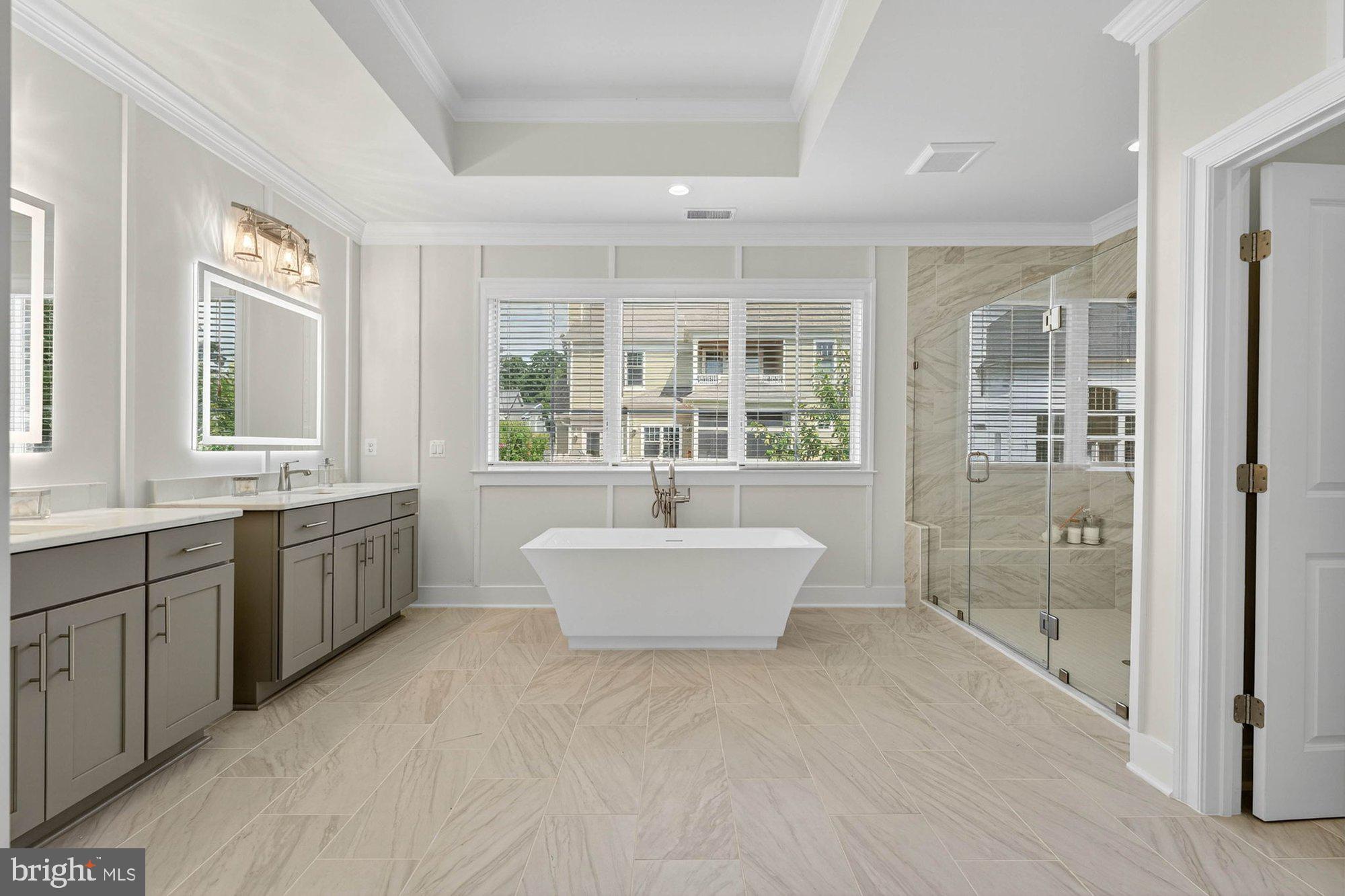 1314 MacBeth Street McLean, VA 22102 - Photo 10 of 13 a large spacious bathroom with a granite countertop tub sink and mirror