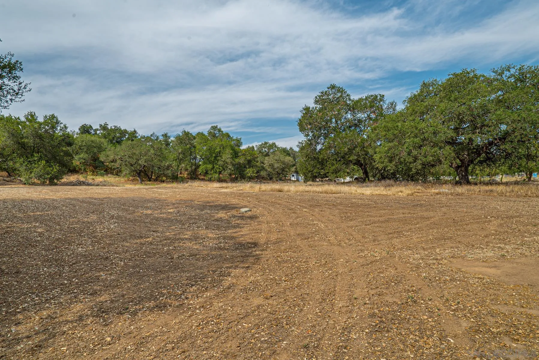 Paradise Mountain Rd Valley Center, Unit 1892302700 Valley Center, CA 92082 - Photo 17 of 24 a view of a field with trees in background