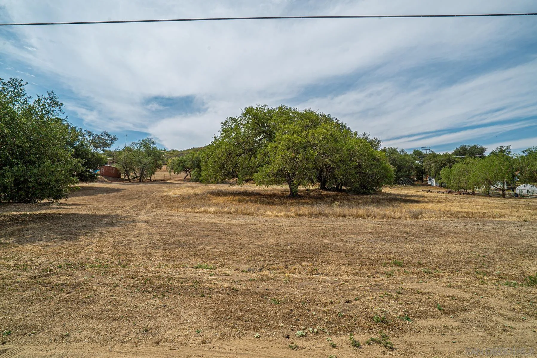 Paradise Mountain Rd Valley Center, Unit 1892302700 Valley Center, CA 92082 - Photo 21 of 24 a view of a field with trees in background