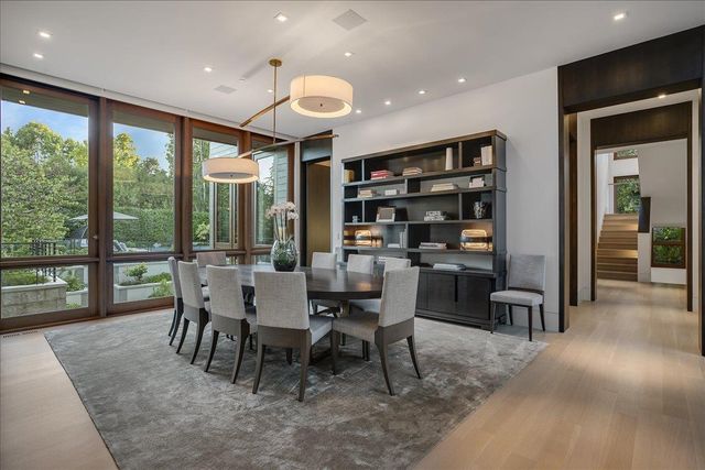 a living room with furniture and a projector screen