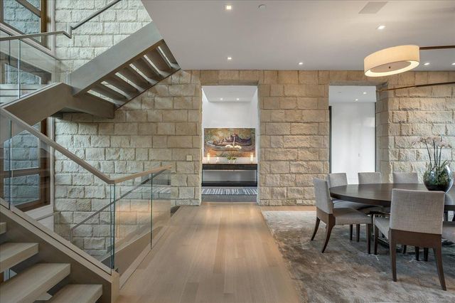 a room with gym equipment and a flat screen tv