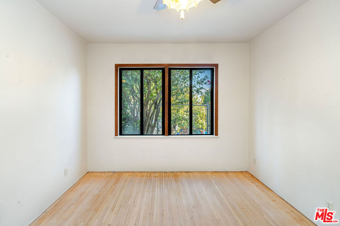 2118 Hilton Drive Burbank, CA 91504 - Photo 22 of 39 a view of an empty room with wooden floor and a window