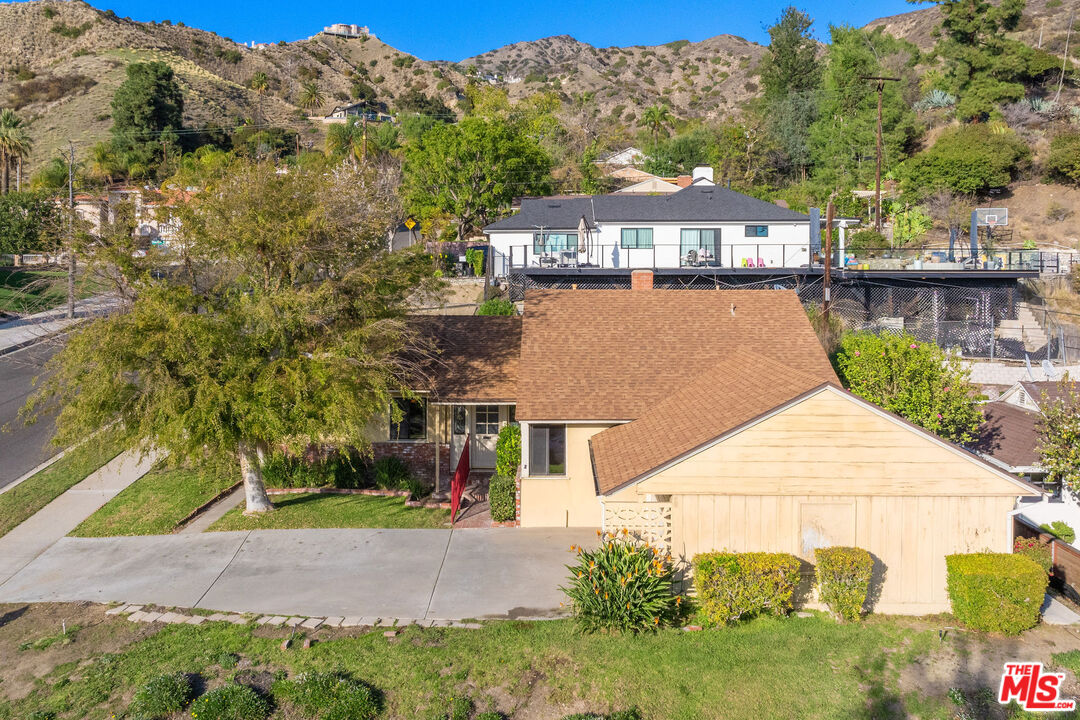 2118 Hilton Drive Burbank, CA 91504 - Photo 32 of 39 a view of a house next to a lake with a large trees