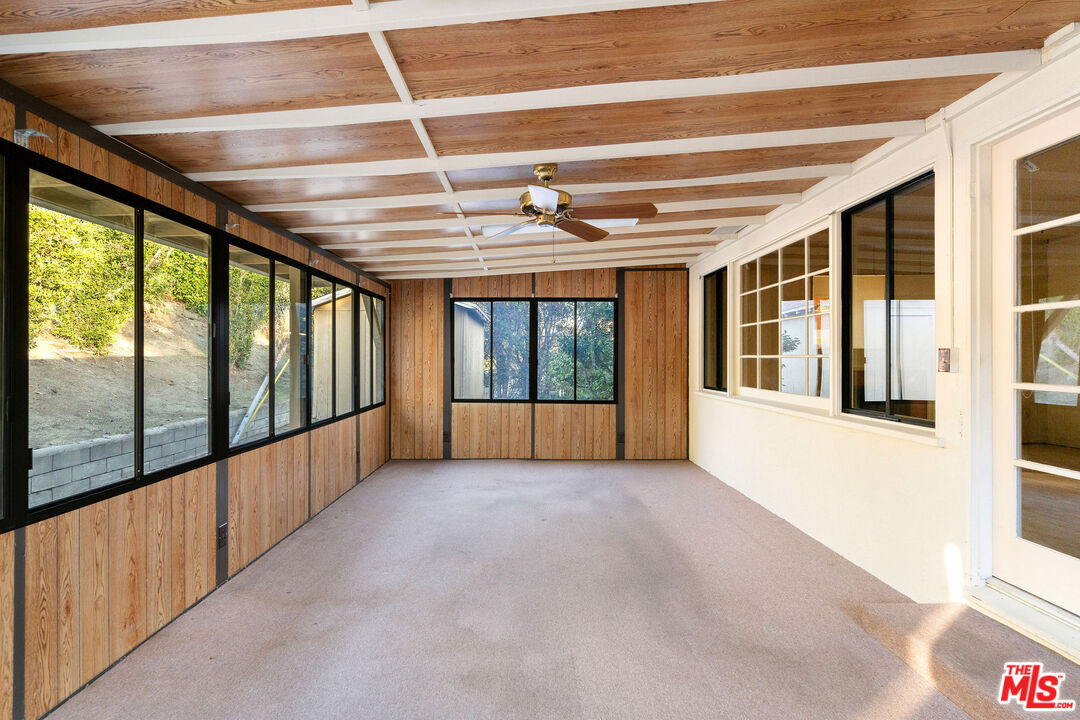 2118 Hilton Drive Burbank, CA 91504 - Photo 6 of 39 a view of an empty room with wooden floor and windows