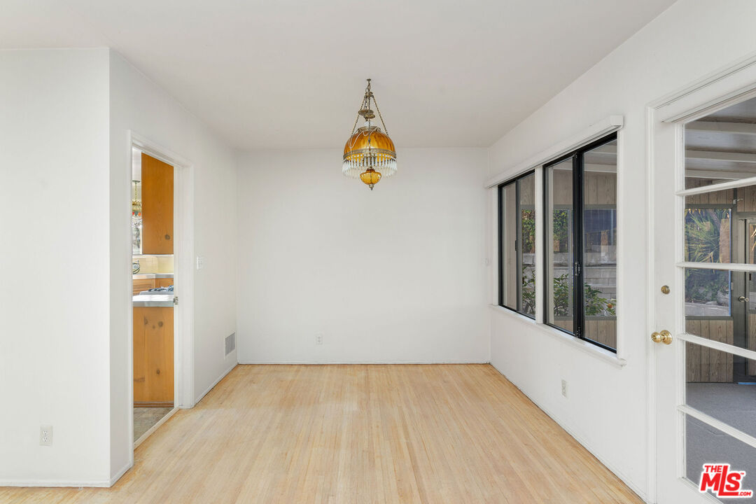 2118 Hilton Drive Burbank, CA 91504 - Photo 9 of 39 wooden floor in an empty room with a window