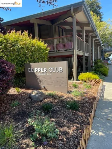 a view of a house with a sign board