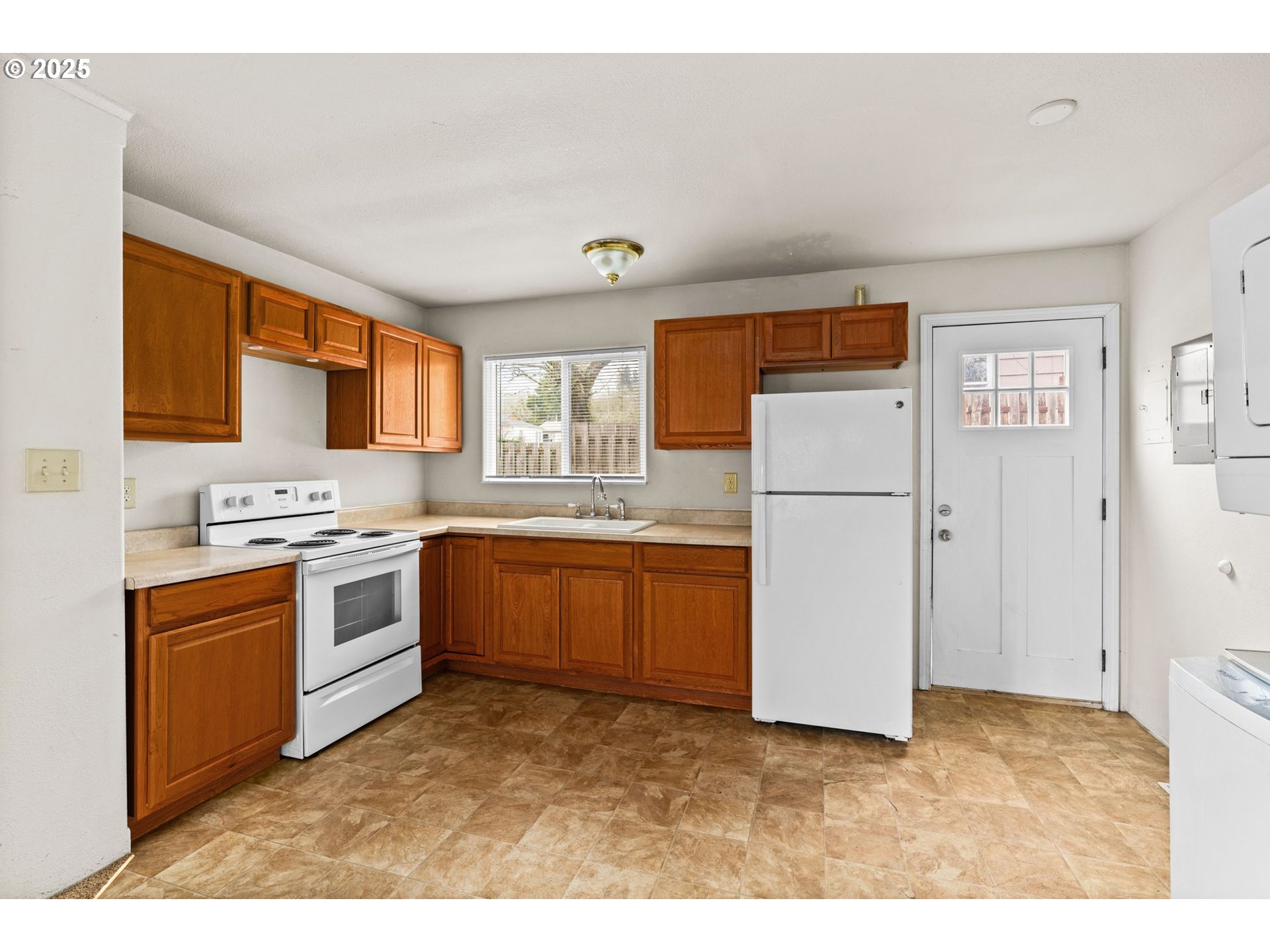 1389 Northeast Brooklyn Avenue Roseburg, OR 97470 - Photo 9 of 19 a kitchen with stainless steel appliances granite countertop a refrigerator sink stove and oven