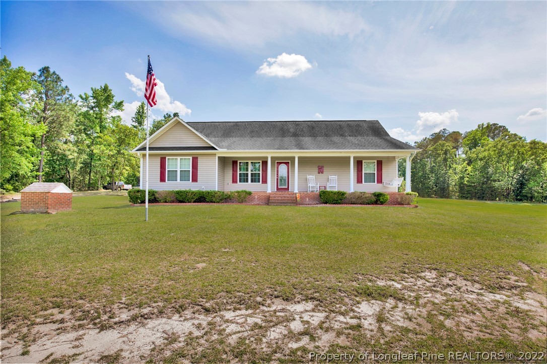 274 Deaton Road Raeford, NC 28376 - Photo 1 of 49 a front view of a house with garden