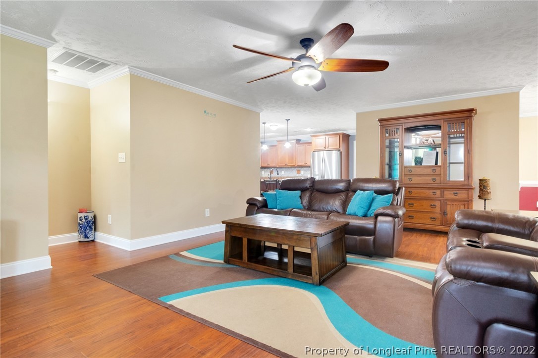 274 Deaton Road Raeford, NC 28376 - Photo 12 of 49 a living room with furniture and a chandelier