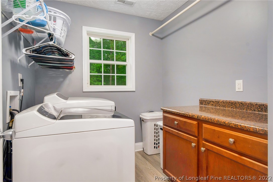 274 Deaton Road Raeford, NC 28376 - Photo 21 of 49 a utility room with dryer and washer