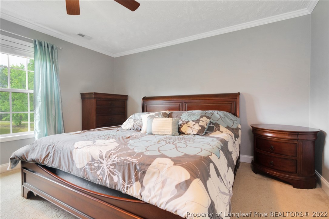 274 Deaton Road Raeford, NC 28376 - Photo 27 of 49 a bedroom with a bed and window
