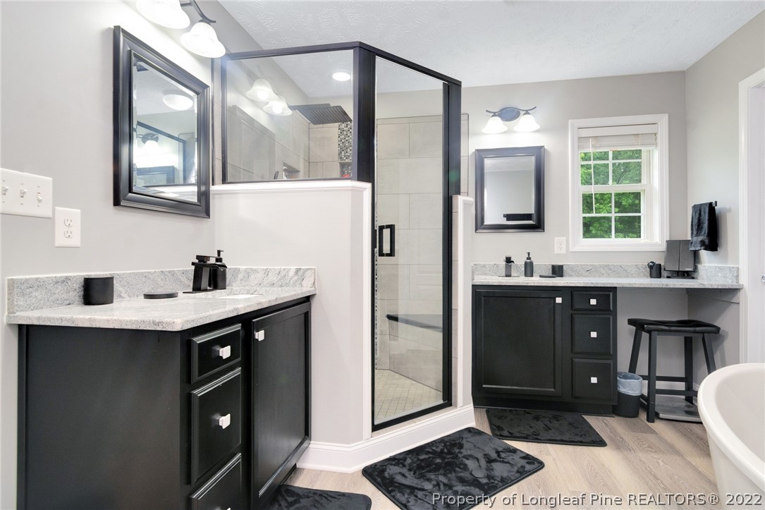 274 Deaton Road Raeford, NC 28376 - Photo 28 of 49 a spacious bathroom with a sink double vanity and a mirror