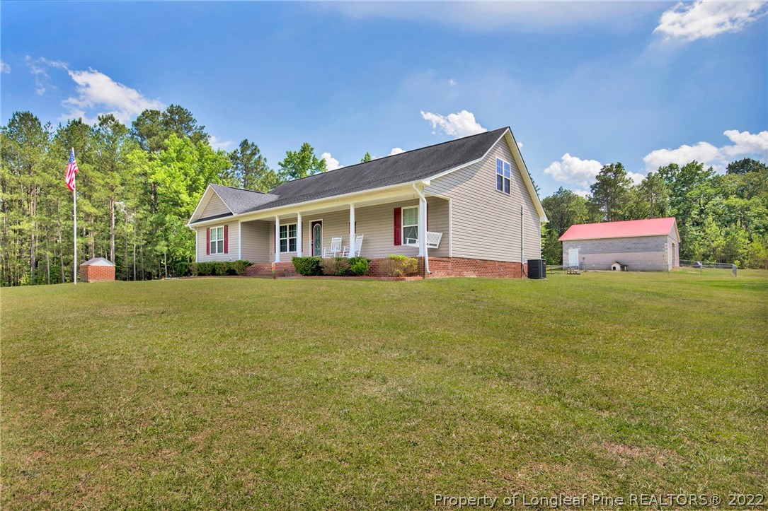 274 Deaton Road Raeford, NC 28376 - Photo 3 of 49 a front view of house with yard and trees