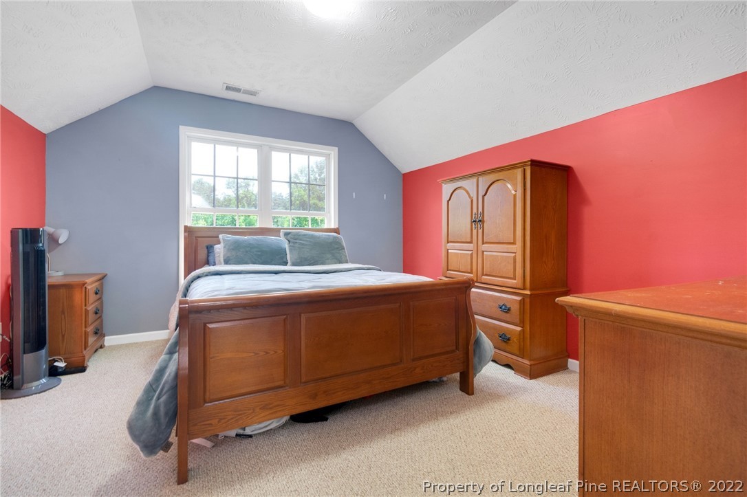 274 Deaton Road Raeford, NC 28376 - Photo 33 of 49 a bed sitting in a room next to a window