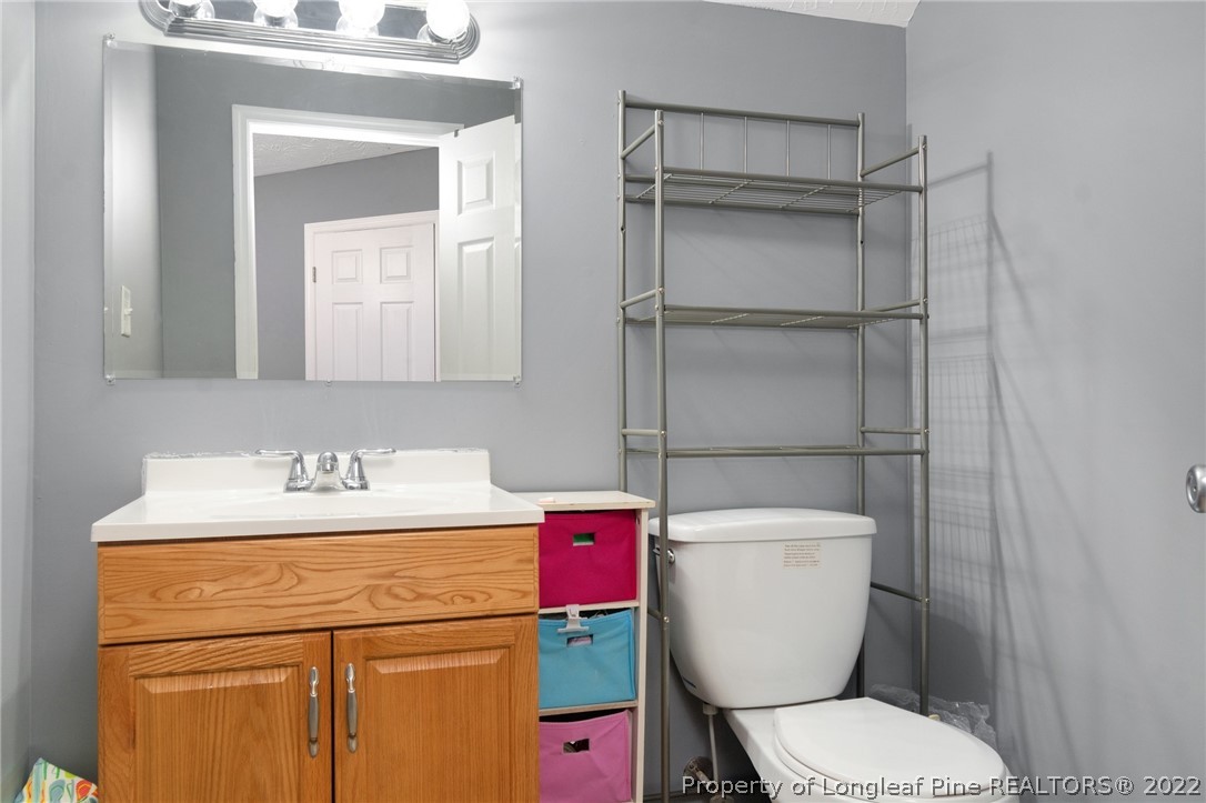 274 Deaton Road Raeford, NC 28376 - Photo 34 of 49 a bathroom with a toilet sink and shower