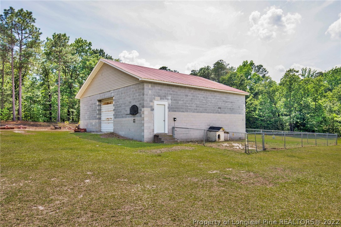 274 Deaton Road Raeford, NC 28376 - Photo 37 of 49 a view of a house with a yard