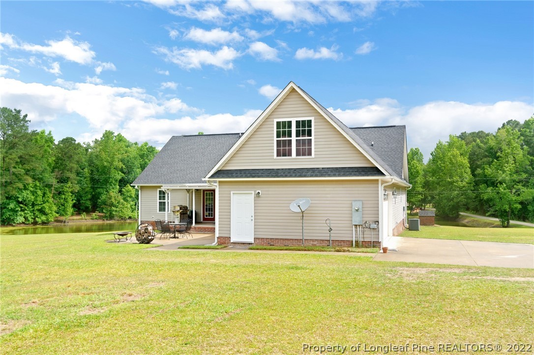 274 Deaton Road Raeford, NC 28376 - Photo 38 of 49 a front view of house with yard and swimming pool