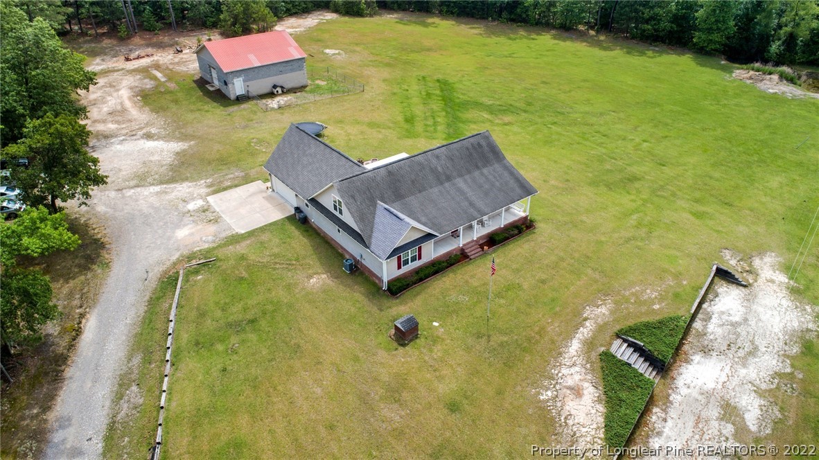 274 Deaton Road Raeford, NC 28376 - Photo 43 of 49 a aerial view of a house with swimming pool and yard