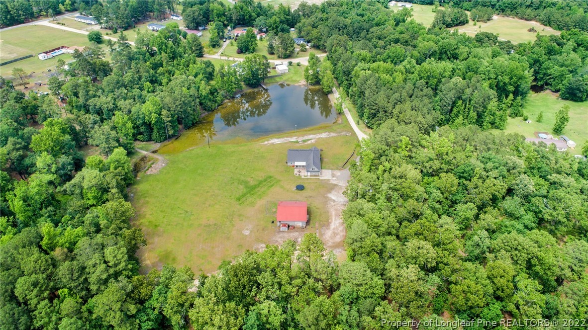 274 Deaton Road Raeford, NC 28376 - Photo 47 of 49 an aerial view of residential houses with outdoor space and trees all around