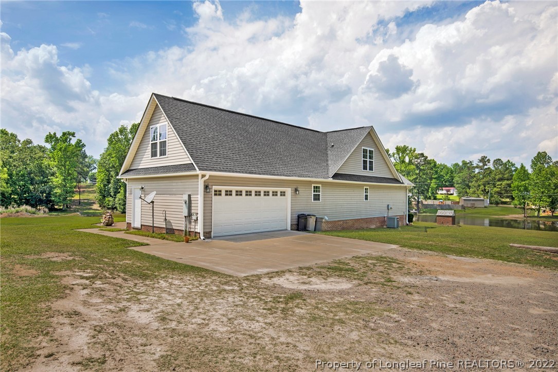 274 Deaton Road Raeford, NC 28376 - Photo 5 of 49 a view of a house with a yard and fence