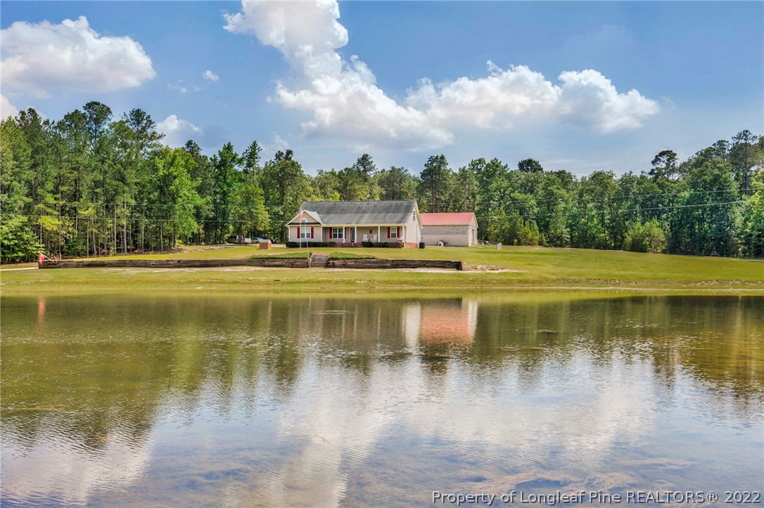274 Deaton Road Raeford, NC 28376 - Photo 8 of 49 a view of a lake with houses
