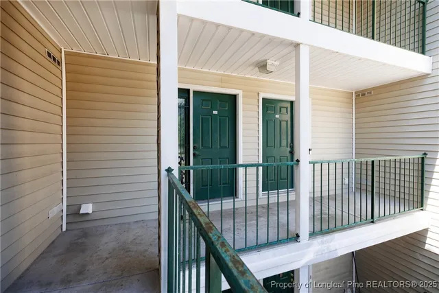 a view of a balcony with fence
