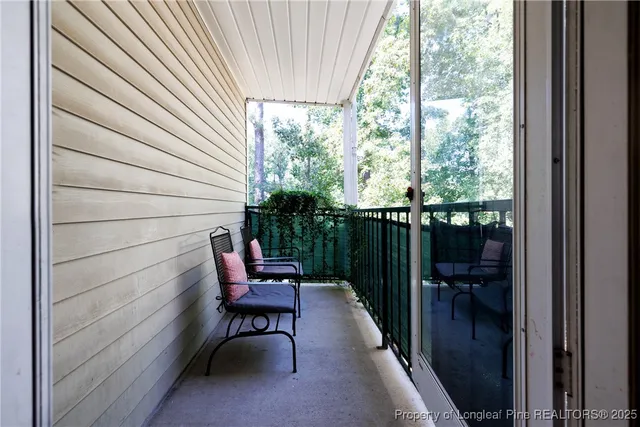 a outdoor view with a sitting space and large windows