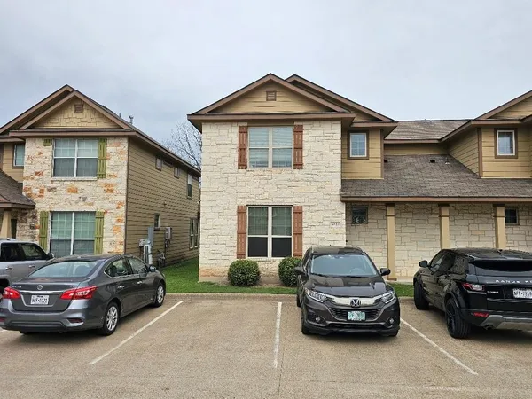 a car parked in front of a house