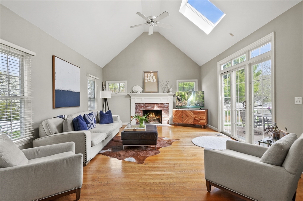 12 Peach Tree Drive Sutton, MA 01590 - Photo 11 of 37 a living room with furniture and a fireplace