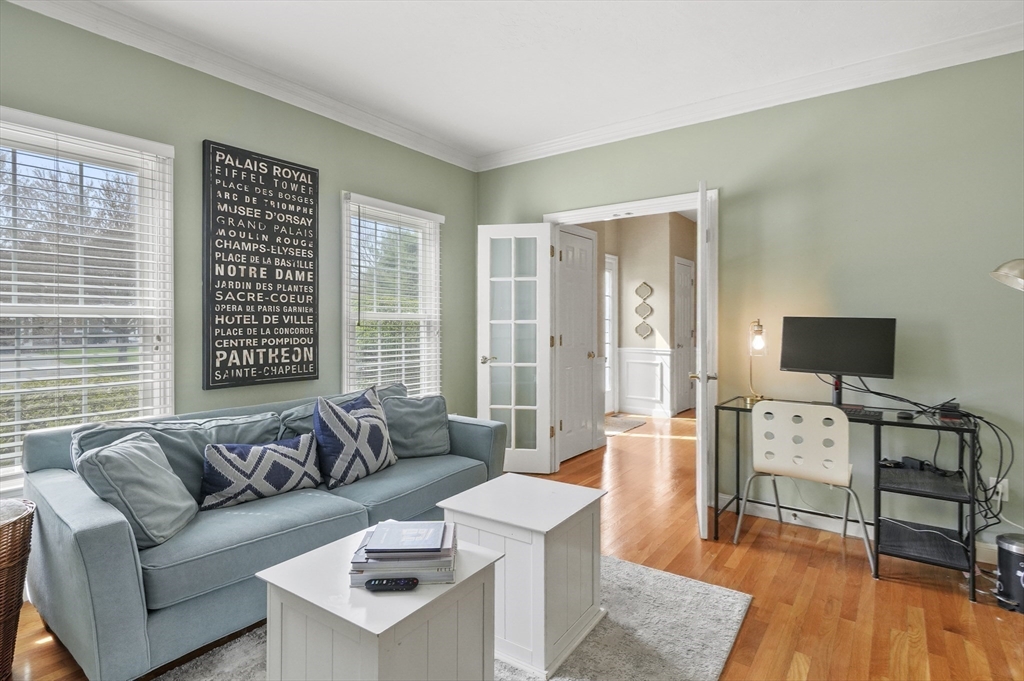 12 Peach Tree Drive Sutton, MA 01590 - Photo 15 of 37 a living room with furniture and a flat screen tv