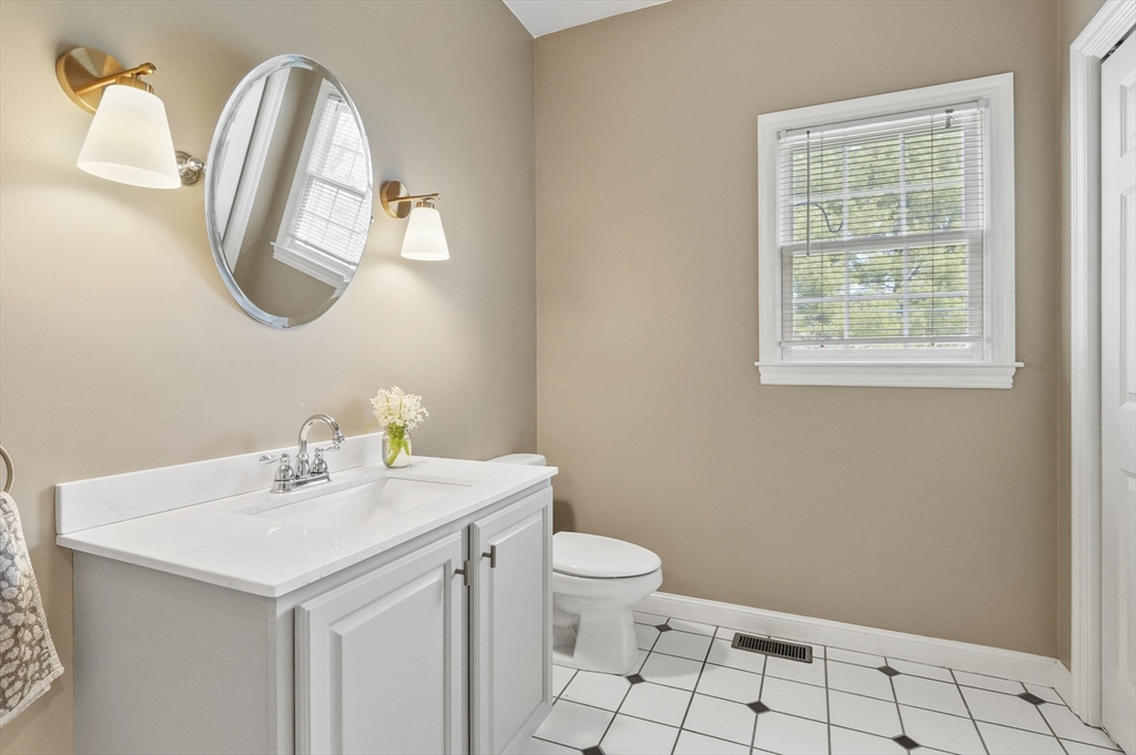 12 Peach Tree Drive Sutton, MA 01590 - Photo 16 of 37 a bathroom with a toilet sink and mirror