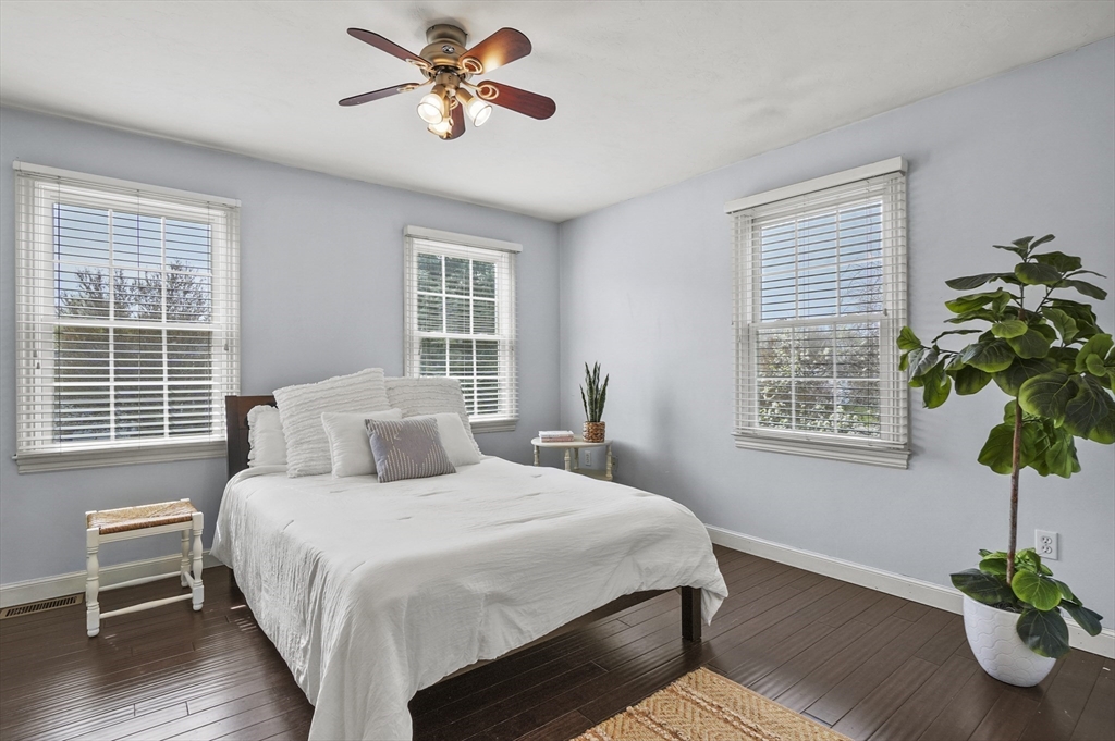 12 Peach Tree Drive Sutton, MA 01590 - Photo 23 of 37 a bedroom with a bed and a potted plant
